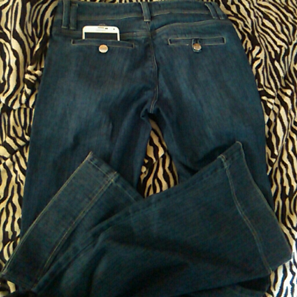 Dark wash jeans button back pockets